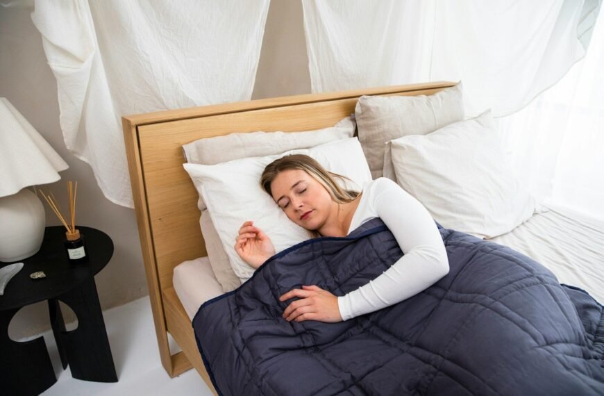 Do Weighted Blankets Actually Help with Anxiety? Person sleeping peacefully under a heavy blanket
