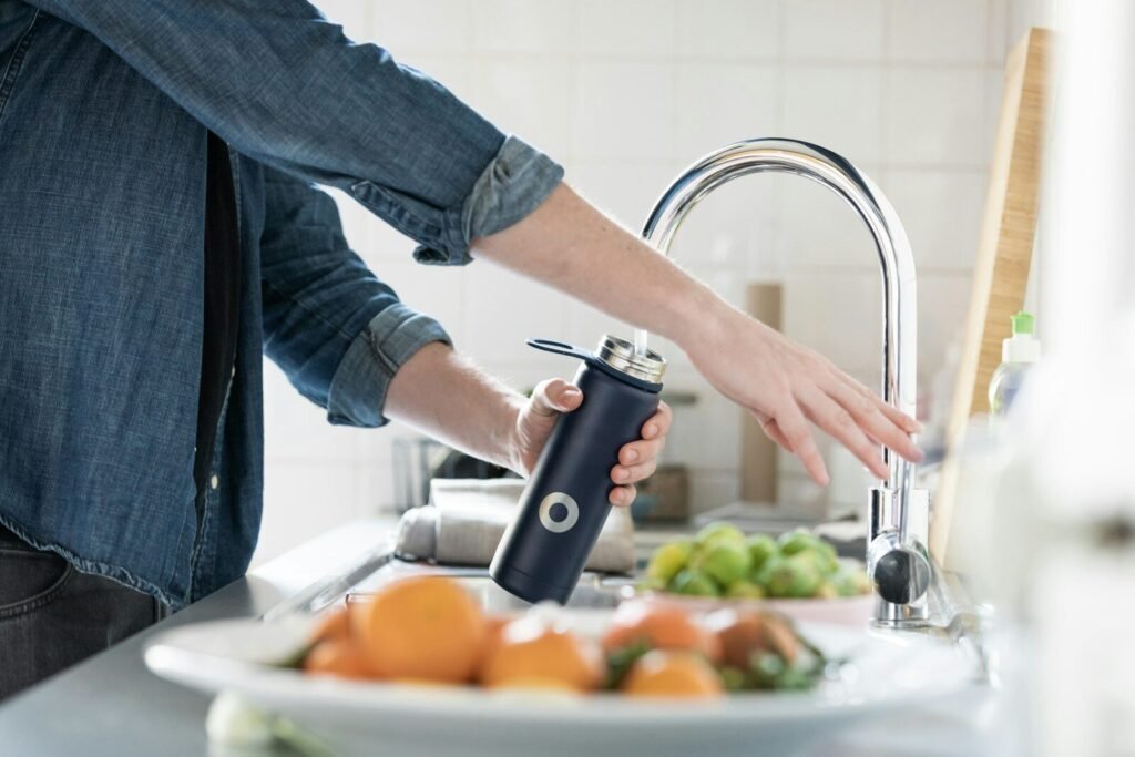 Best Under-Sink Water Filter - Clean filtered water flowing from kitchen faucet