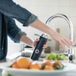 Best Under-Sink Water Filter - Clean filtered water flowing from kitchen faucet