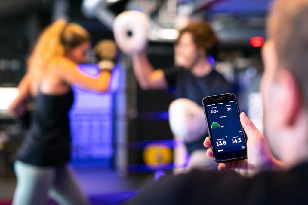 Fitness app displaying body weight trend graph on smartphone