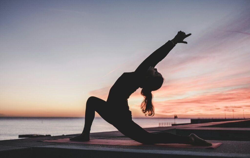 Practitioner in hot yoga class on a grippy mat