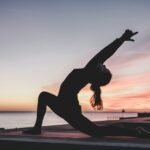 Best Yoga Mat for Yoga. Practitioner in hot yoga class on a grippy mat