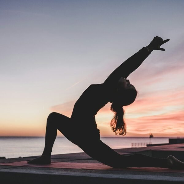 Best Yoga Mat for Yoga. Practitioner in hot yoga class on a grippy mat