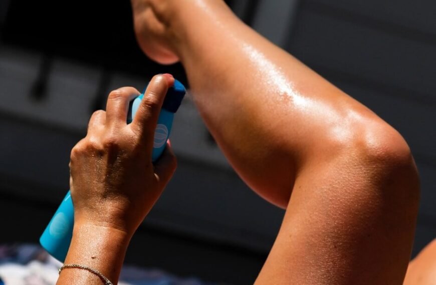 Best Outdoor Mosquito Repellent - Person applying insect repellent spray on legs before outdoor activity