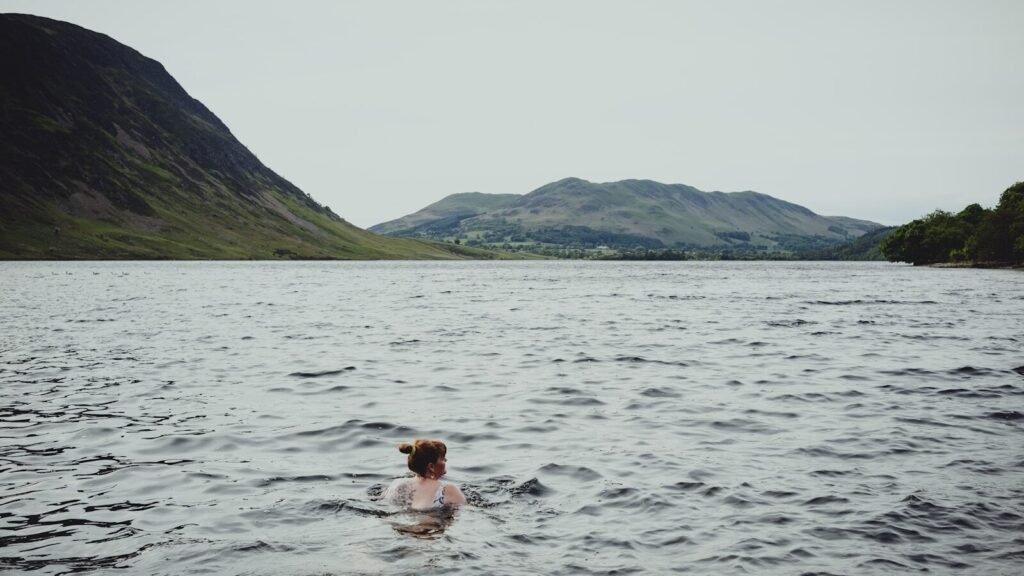 Wild swimmer in lake with open water with no goggles